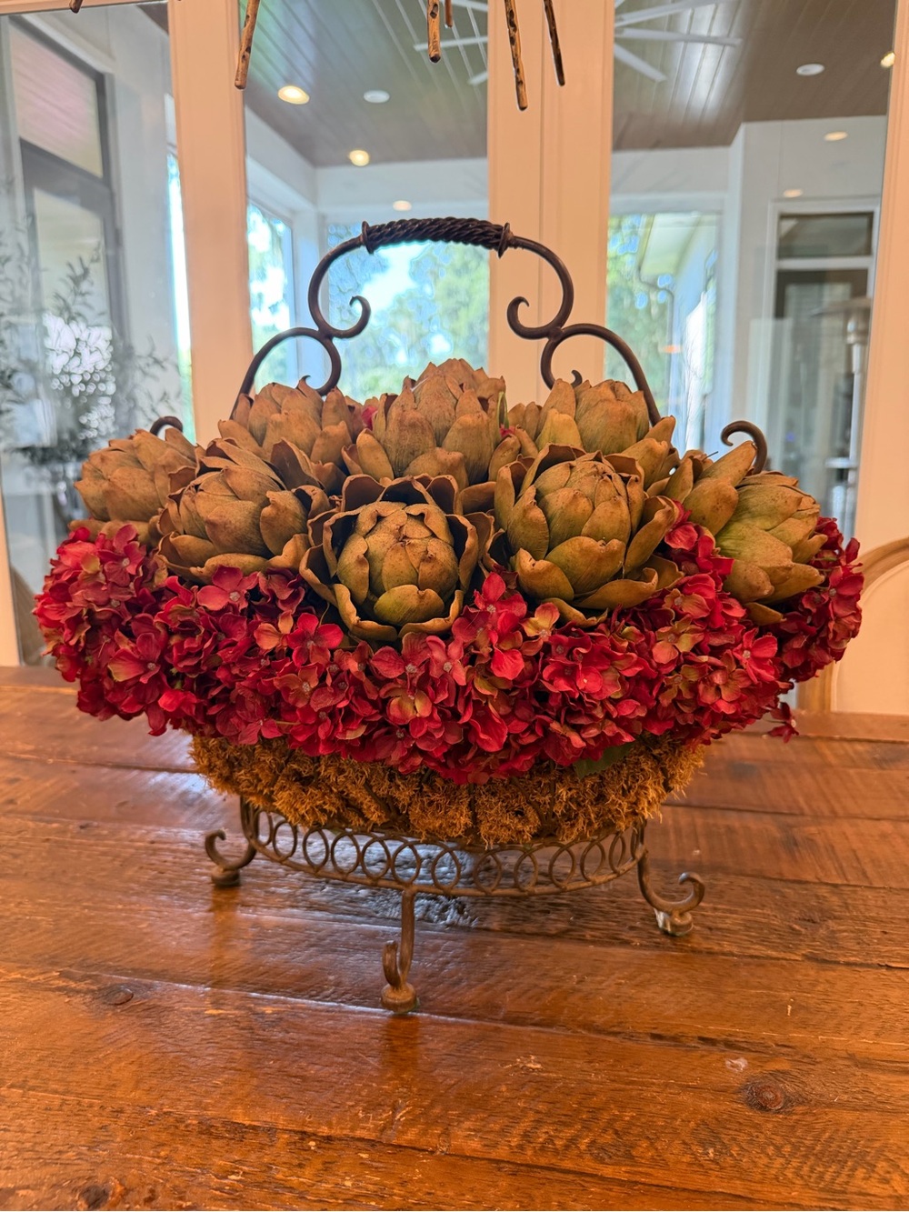 Rustic Iron Basket Centerpiece with Green Artichoke and Red Hydrangea Accents